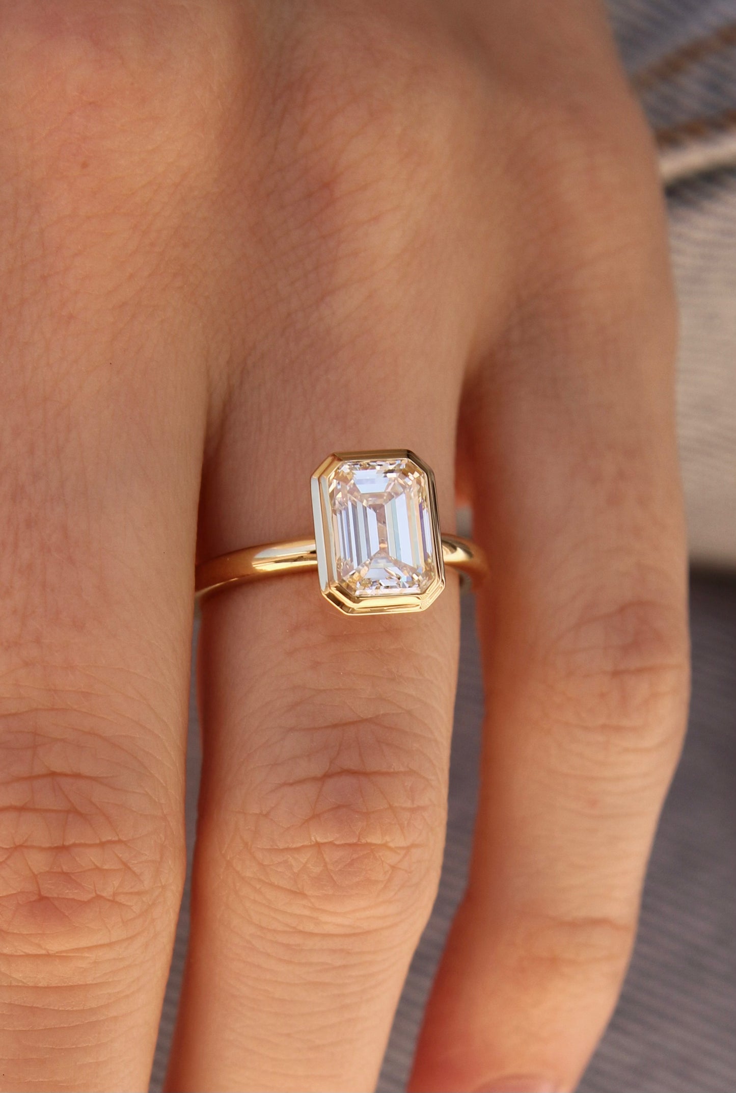 AHONA EMERALD BEZEL SOLITAIRE