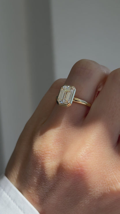 AHONA EMERALD BEZEL SOLITAIRE